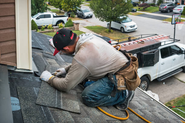 Professional Roof Replacement technician working in Guilford, NY